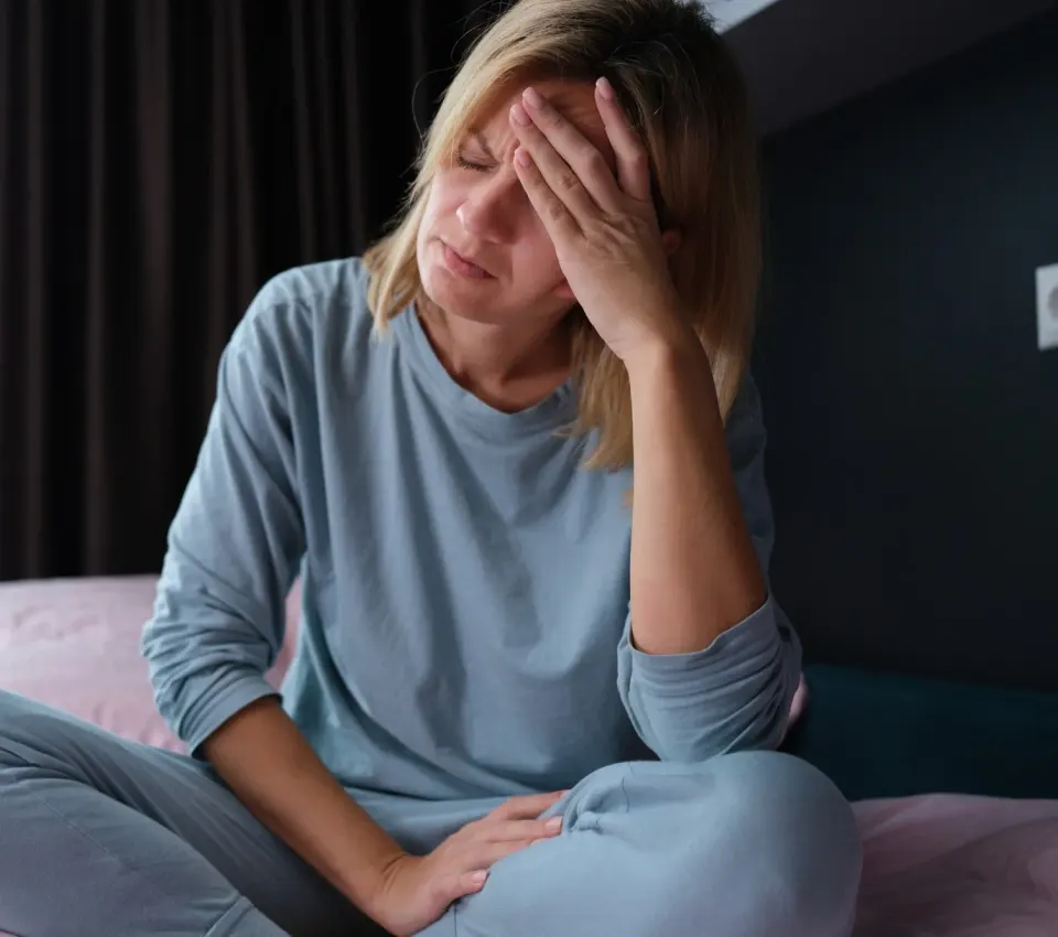 Woman recognizing perimenopause symptoms